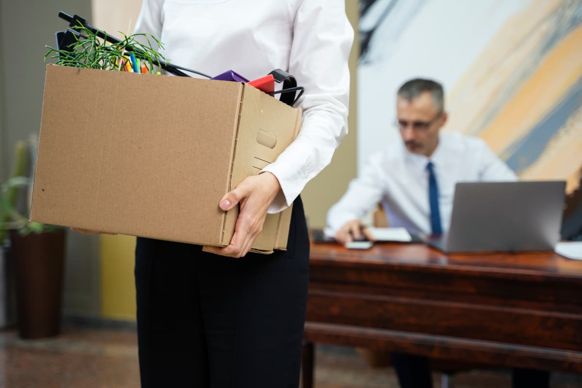 man carrying cardboard box side view