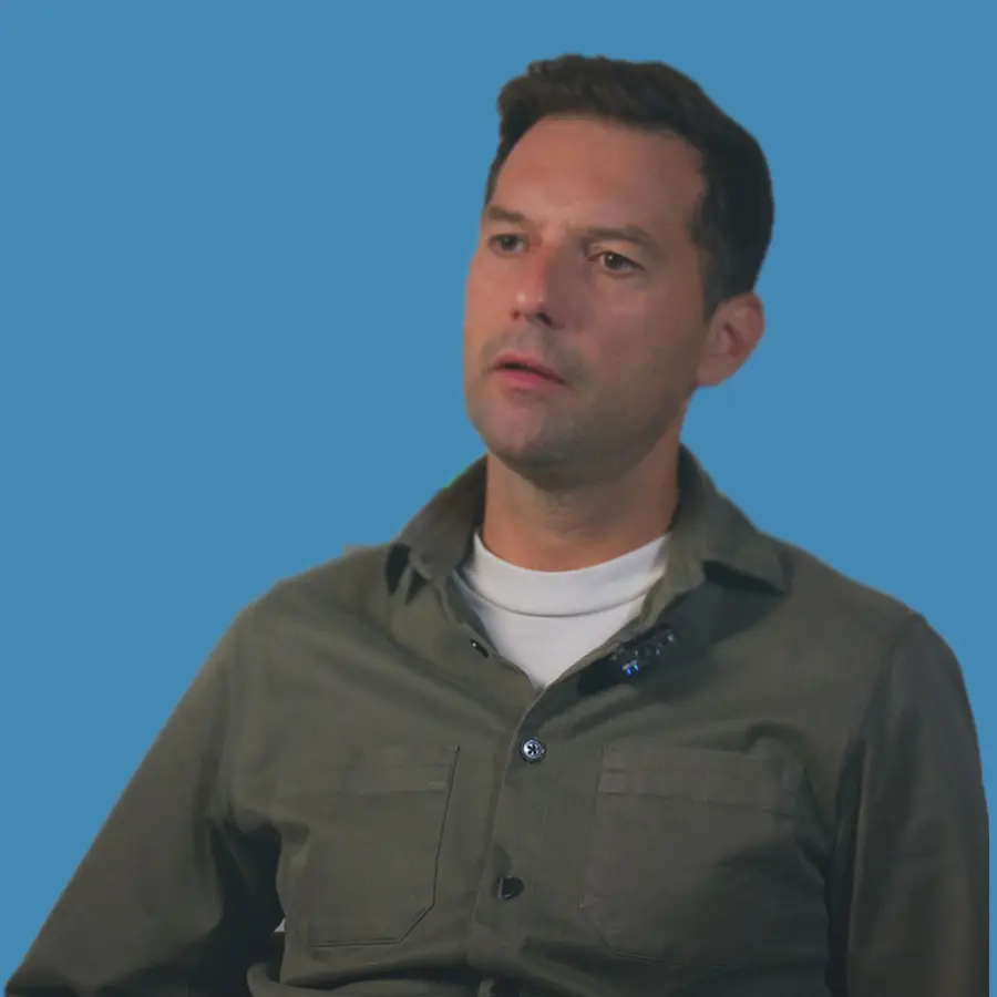 man in front of blue background