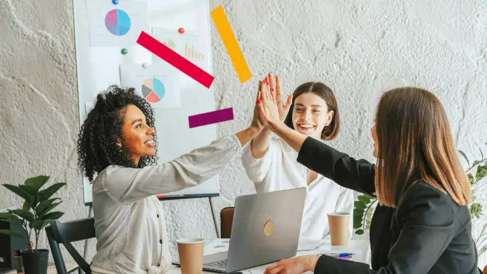 FI_three women high fiving while sitting_hero image_960x540
