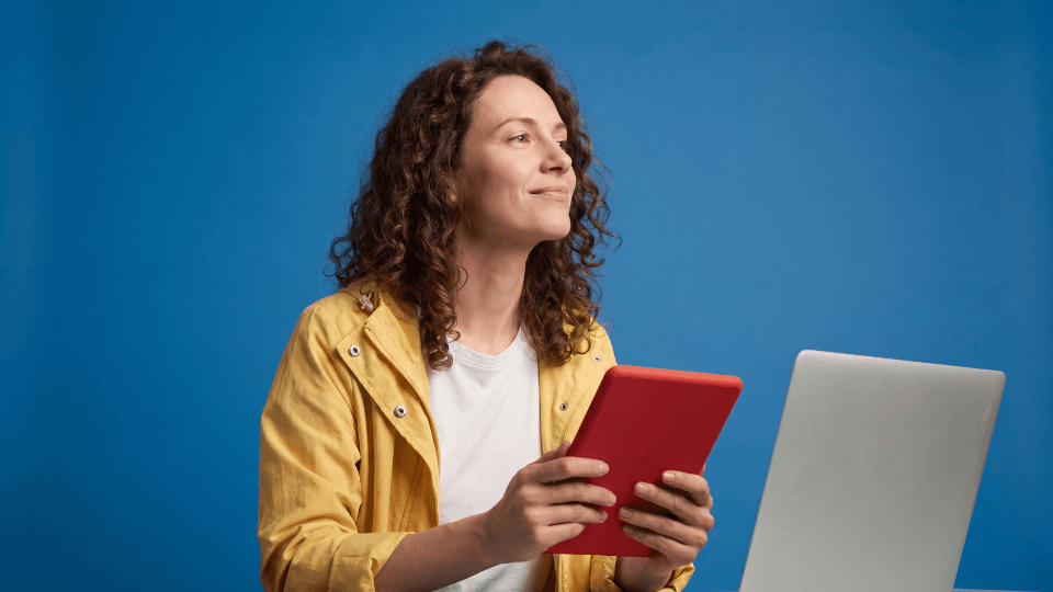 Woman yellow jacket ipad laptop