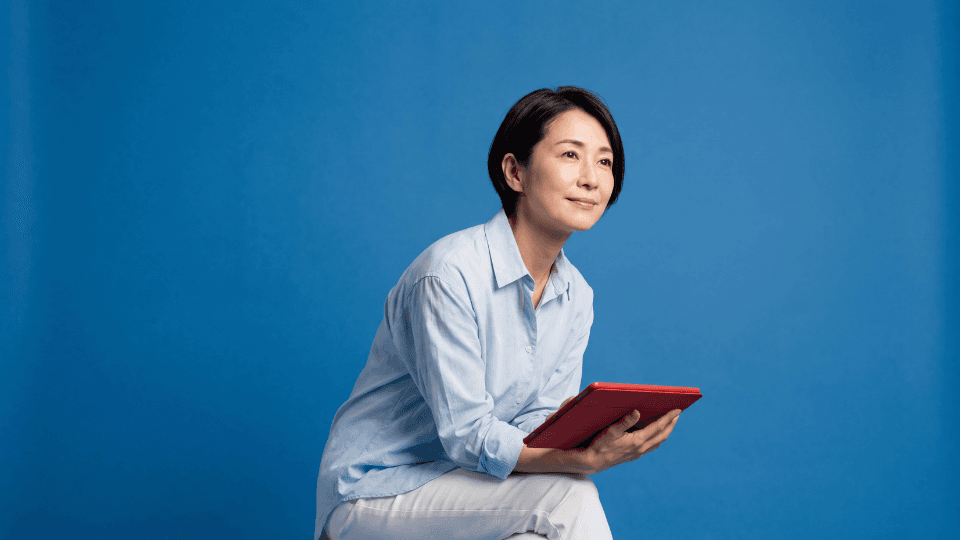 Woman sitting leaning confident ipad